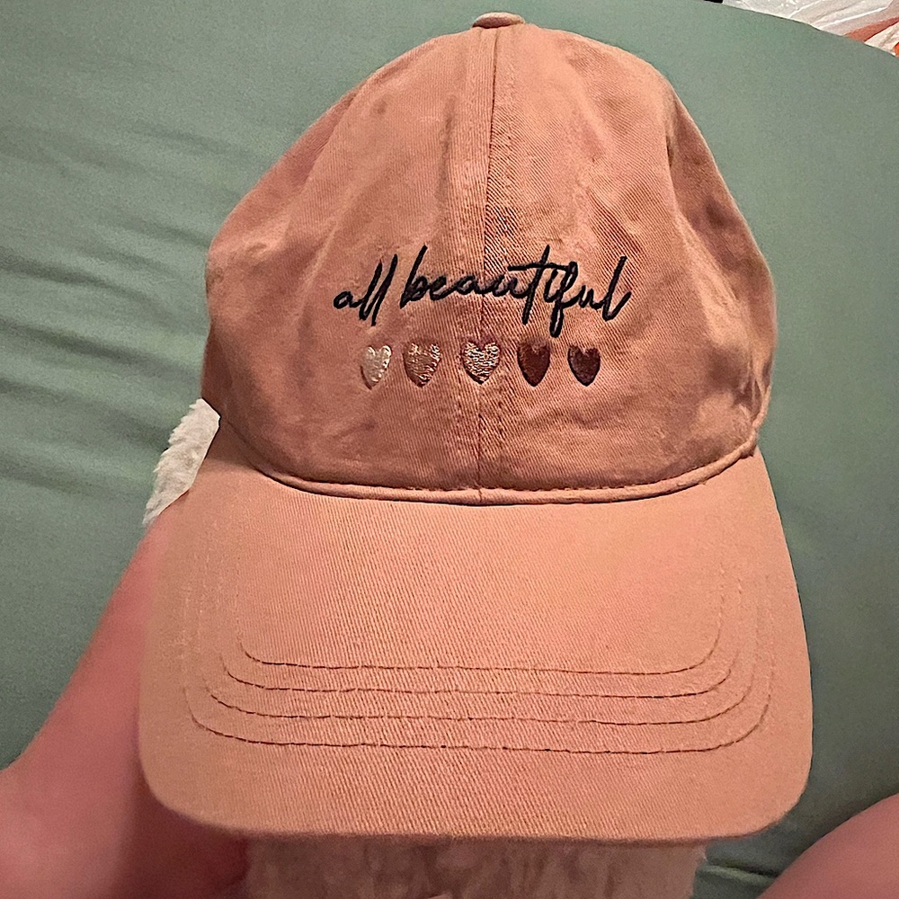 All beautiful hat. Super cute brown with embroidery